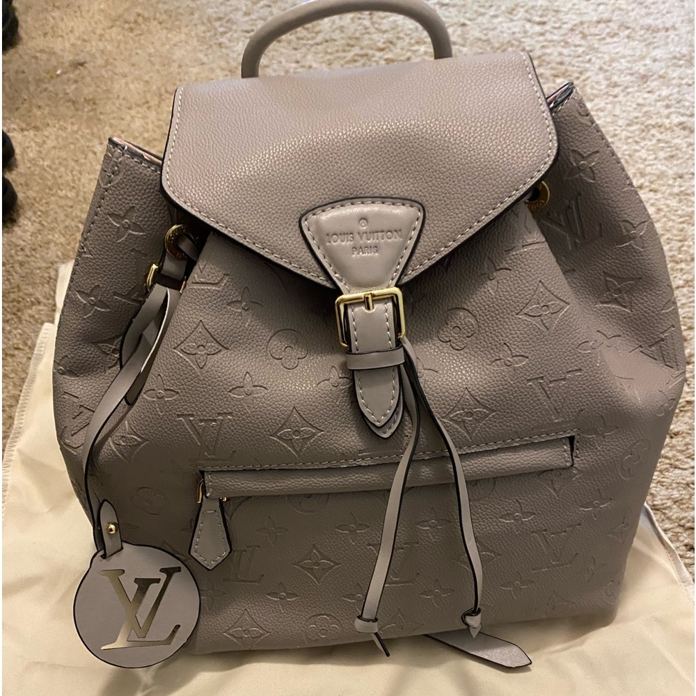 Backpack purse with matching wallet.